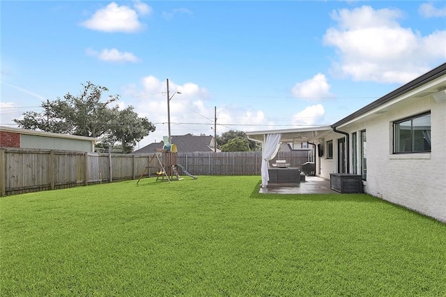 4548 Alphonse Dr, Metairie, LA 70006 - fenced backyard with a patio, a playground, and an outdoor living space