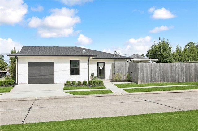 4548 Alphonse Dr, Metairie, LA 70006 - view of front of home featuring concrete driveway, an attached garage, and roof with shingles