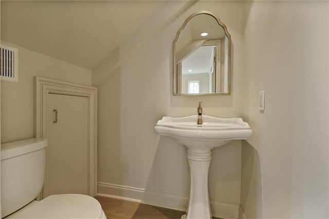 2232 N Starrett Rd, Metairie, LA 70003 - half bath featuring toilet and baseboards