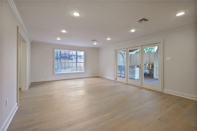 2232 N Starrett Rd, Metairie, LA 70003 - unfurnished room featuring ornamental molding, plenty of natural light, light wood-style flooring, and recessed lighting