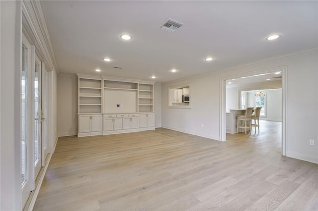 2232 N Starrett Rd, Metairie, LA 70003 - unfurnished living room featuring crown molding, recessed lighting, and light wood-style floors