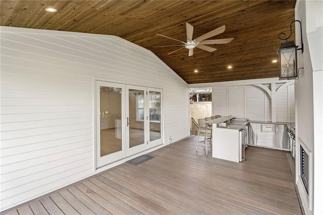 2232 N Starrett Rd, Metairie, LA 70003 - deck with french doors, a ceiling fan, and outdoor dining space