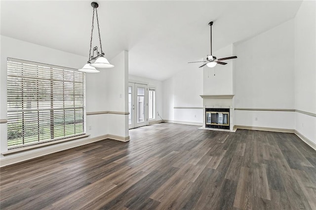 32 S Court Villa Dr Unit 32, Mandeville, LA 70471 - unfurnished living room featuring dark wood-style flooring, a ceiling fan, a fireplace with flush hearth, and lofted ceiling