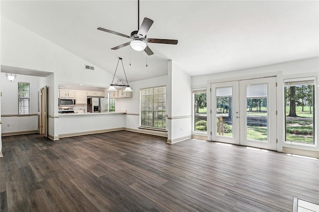 32 S Court Villa Dr Unit 32, Mandeville, LA 70471 - unfurnished living room featuring healthy amount of natural light, dark wood finished floors, ceiling fan, and high vaulted ceiling