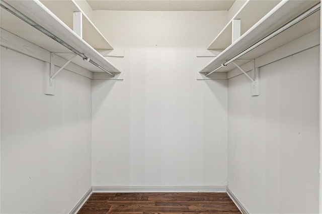 32 S Court Villa Dr Unit 32, Mandeville, LA 70471 - spacious closet featuring dark wood finished floors