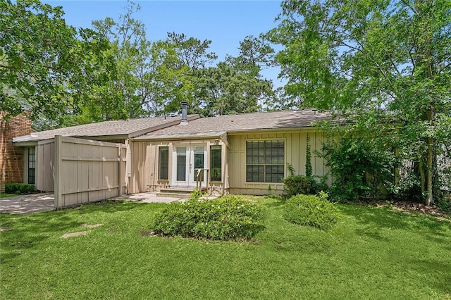 32 S Court Villa Dr Unit 32, Mandeville, LA 70471 - back of house with board and batten siding