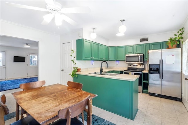 4370 Lasalle St -, Unit New Orleans, LA 70115 - kitchen featuring appliances with stainless steel finishes, green cabinetry, a peninsula, ceiling fan, and crown molding