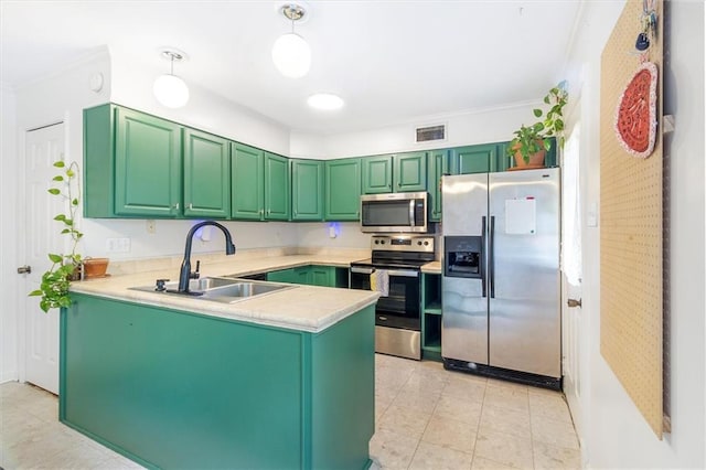 4370 Lasalle St -, Unit New Orleans, LA 70115 - kitchen featuring stainless steel appliances, light countertops, a peninsula, light tile patterned floors, and ornamental molding
