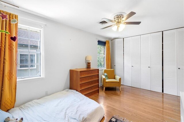 4370 Lasalle St -, Unit New Orleans, LA 70115 - bedroom with multiple windows, wood finished floors, and ceiling fan