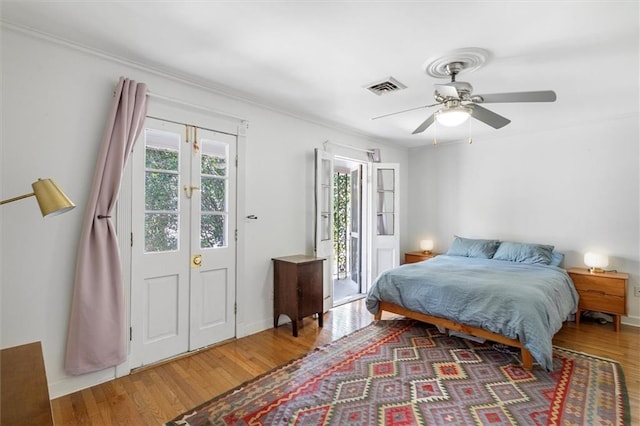 4370 Lasalle St -, Unit New Orleans, LA 70115 - bedroom with wood finished floors, crown molding, ceiling fan, and access to outside