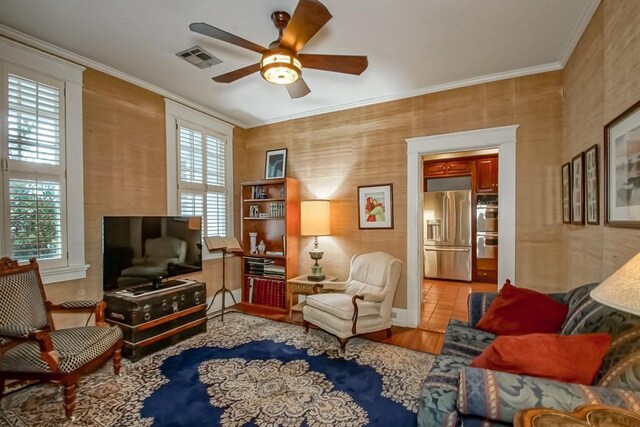 2410 Adams St, New Orleans, LA 70125 - sitting room with ceiling fan, crown molding, and wood finished floors