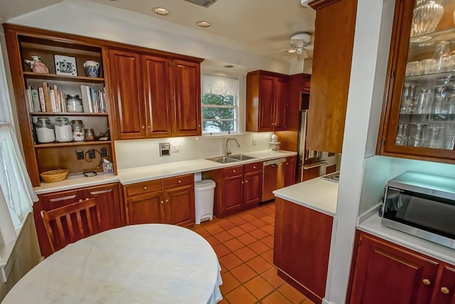 2410 Adams St, New Orleans, LA 70125 - kitchen featuring stainless steel appliances, a ceiling fan, light countertops, light tile patterned floors, and recessed lighting