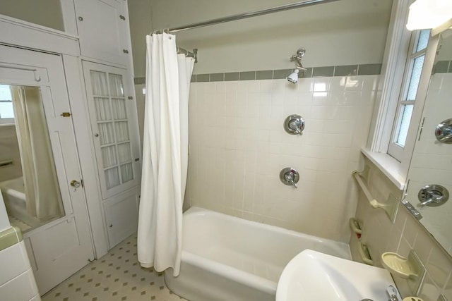 2410 Adams St, New Orleans, LA 70125 - bathroom featuring tile patterned floors and shower / bathtub combination with curtain