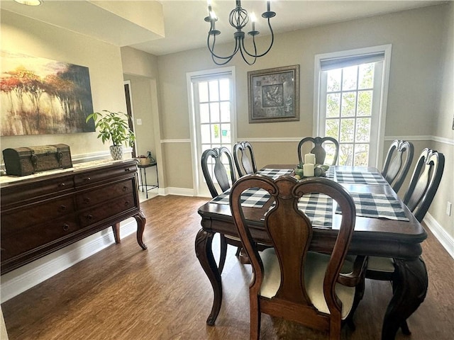 4908 David Dr, Kenner, LA 70065 - dining space featuring healthy amount of natural light, dark wood-style flooring, and a chandelier