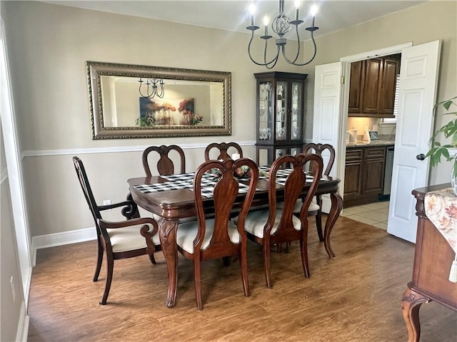 4908 David Dr, Kenner, LA 70065 - dining area featuring light wood-style flooring and a chandelier