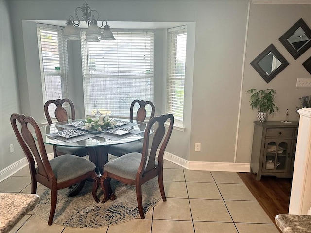4908 David Dr, Kenner, LA 70065 - dining area with a chandelier, plenty of natural light, and tile patterned flooring
