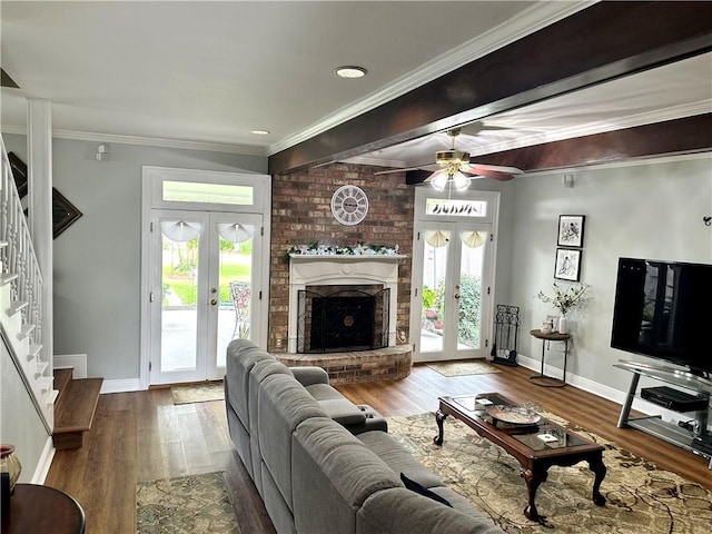 4908 David Dr, Kenner, LA 70065 - living room featuring french doors, stairway, wood finished floors, and ornamental molding