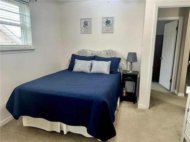 4908 David Dr, Kenner, LA 70065 - bedroom featuring light carpet and baseboards