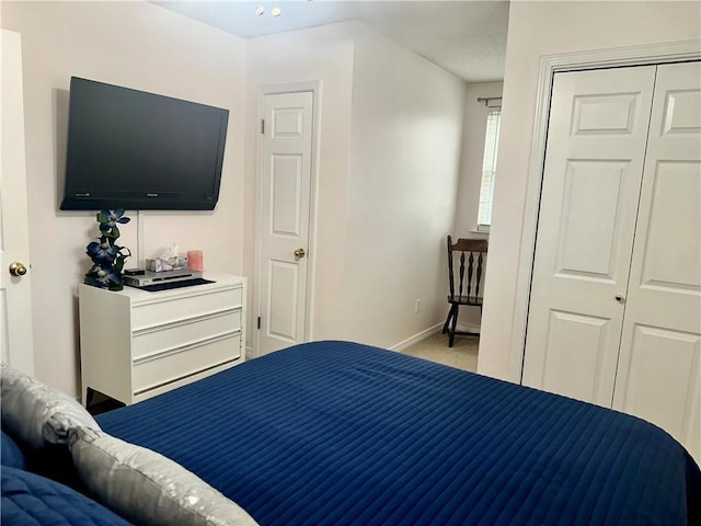 4908 David Dr, Kenner, LA 70065 - carpeted bedroom with baseboards and a closet