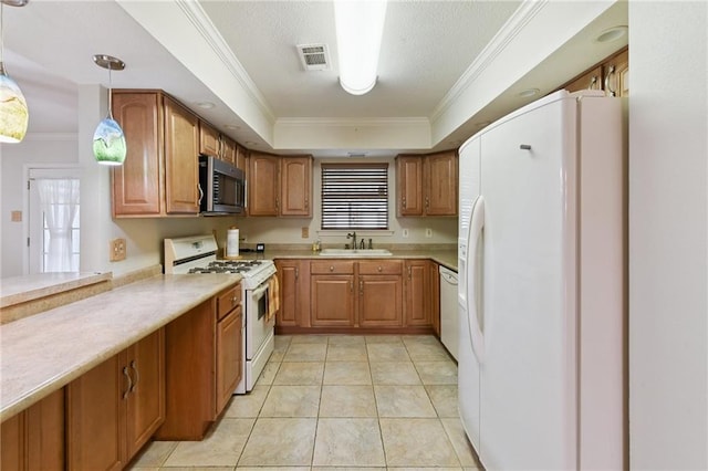 4520 Fairfield St, Metairie, LA 70006 - kitchen with white appliances, crown molding, light countertops, brown cabinetry, and pendant lighting