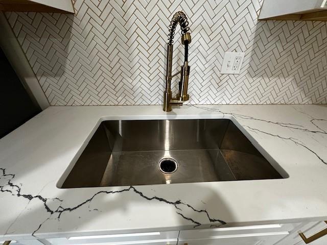 1018 Marian Ave, Metairie, LA 70001 - kitchen view of a sink and light stone countertops