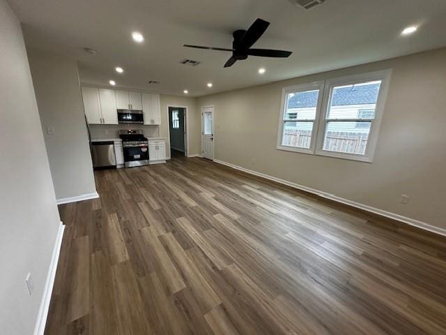 1018 Marian Ave, Metairie, LA 70001 - unfurnished living room with ceiling fan, dark wood finished floors, and recessed lighting