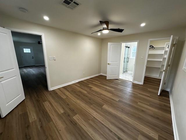 1018 Marian Ave, Metairie, LA 70001 - unfurnished bedroom with recessed lighting, a walk in closet, dark wood-style floors, and ceiling fan
