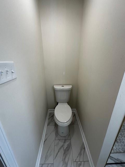 1018 Marian Ave, Metairie, LA 70001 - bathroom featuring toilet and marble finish flooring