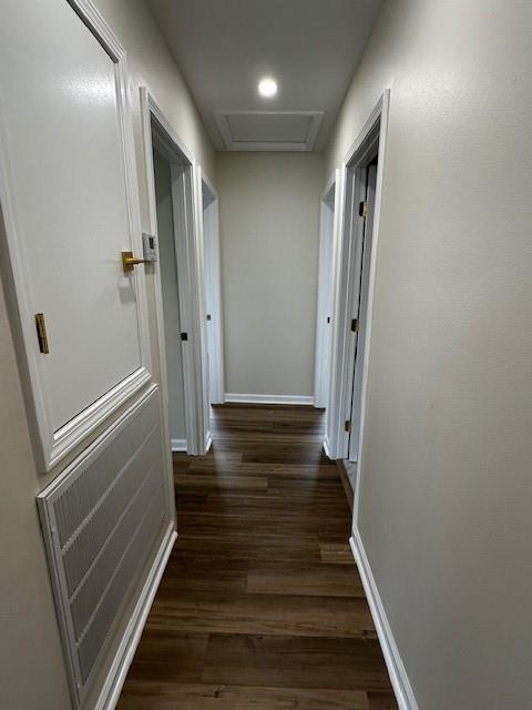 1018 Marian Ave, Metairie, LA 70001 - corridor featuring dark wood finished floors and attic access