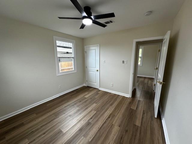 1018 Marian Ave, Metairie, LA 70001 - unfurnished bedroom with dark wood-type flooring and a ceiling fan