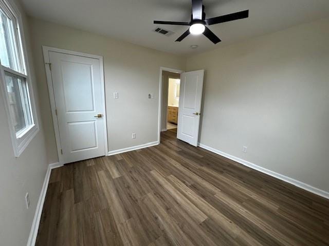 1018 Marian Ave, Metairie, LA 70001 - unfurnished bedroom with dark wood finished floors and a ceiling fan