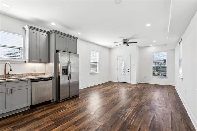 301113 Wall Blvd, New Orleans, LA 70114 - kitchen featuring stainless steel appliances, gray cabinetry, dark wood-style floors, a ceiling fan, and recessed lighting