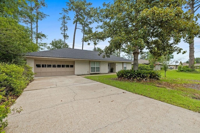 708 W Colorado Ave, Hammond, LA 70401 - ranch-style home with a garage, driveway, brick siding, and a front lawn