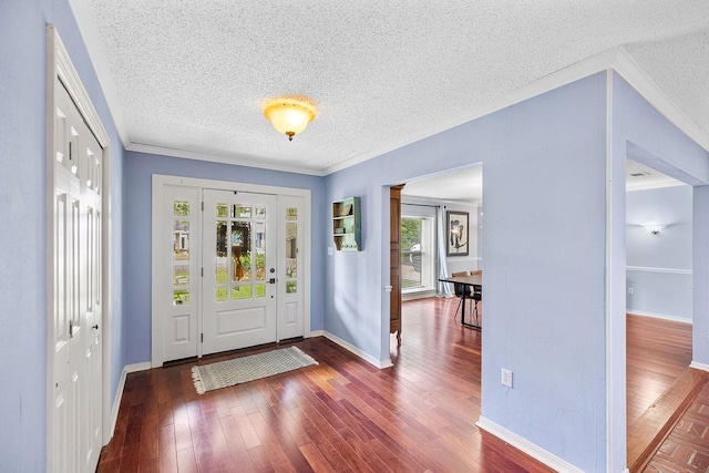 708 W Colorado Ave, Hammond, LA 70401 - foyer with a textured ceiling, ornamental molding, and wood-type flooring