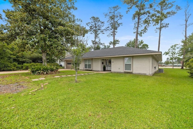 708 W Colorado Ave, Hammond, LA 70401 - back of property featuring a garage and a lawn