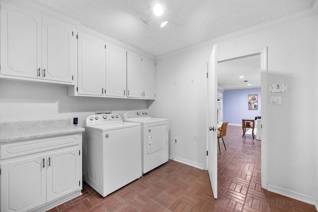 708 W Colorado Ave, Hammond, LA 70401 - laundry room with brick patterned flooring, cabinet space, independent washer and dryer, a textured ceiling, and crown molding