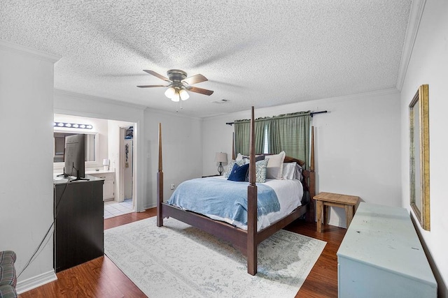 708 W Colorado Ave, Hammond, LA 70401 - bedroom featuring wood finished floors, a textured ceiling, ornamental molding, ceiling fan, and ensuite bathroom