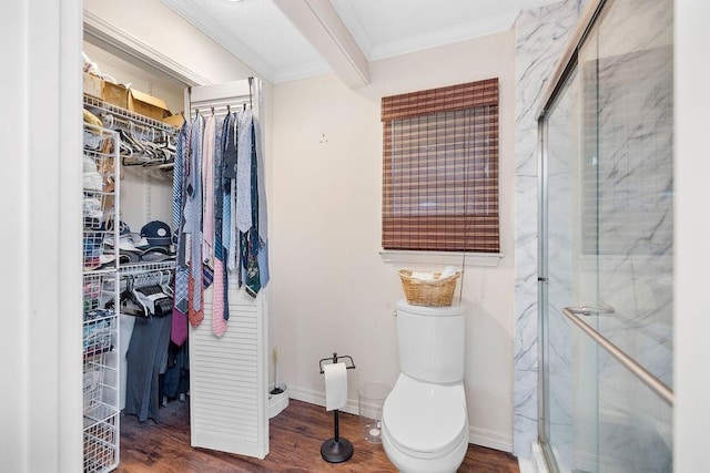 708 W Colorado Ave, Hammond, LA 70401 - bathroom with ornamental molding, a marble finish shower, a walk in closet, and wood finished floors