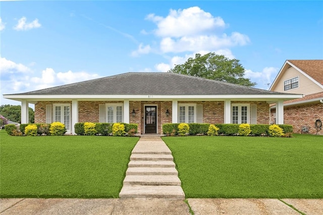 811 Franklin Ct, Slidell, LA 70458 - view of front of home with french doors, brick siding, and a front yard