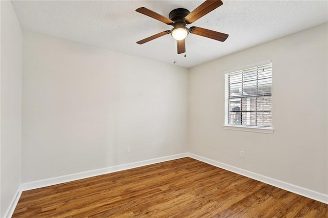 811 Franklin Ct, Slidell, LA 70458 - spare room with wood finished floors, a ceiling fan, and a textured ceiling
