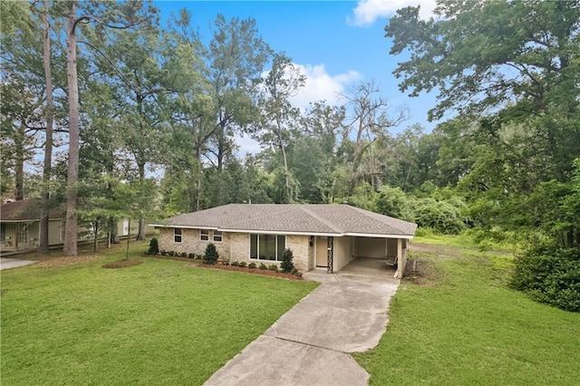 310 Blackburn Rd, Hammond, LA 70401 - view of front of property featuring driveway, a front lawn, and an attached carport