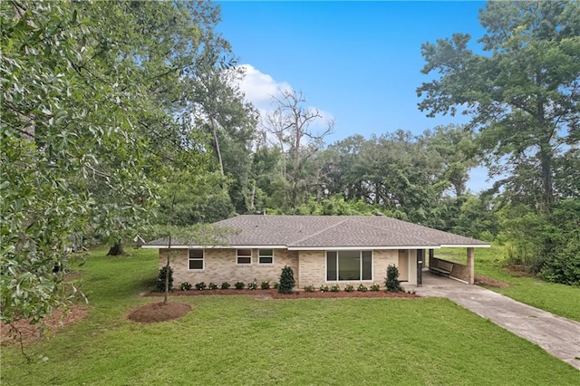 310 Blackburn Rd, Hammond, LA 70401 - view of front of property with driveway, a carport, and a front lawn