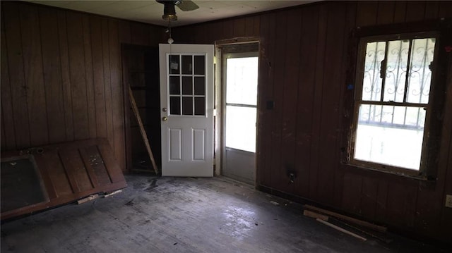 221 College Rd, Eunice, LA 70535 - entrance foyer with wooden walls, healthy amount of natural light, and ceiling fan