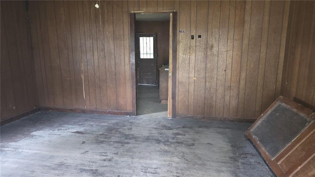 221 College Rd, Eunice, LA 70535 - unfurnished room featuring wood walls and wood finished floors