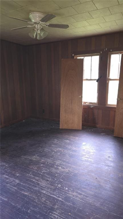 221 College Rd, Eunice, LA 70535 - empty room with wooden walls and ceiling fan