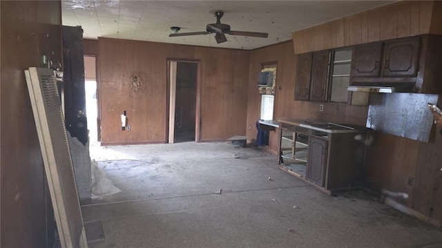 221 College Rd, Eunice, LA 70535 - kitchen featuring a ceiling fan and wooden walls