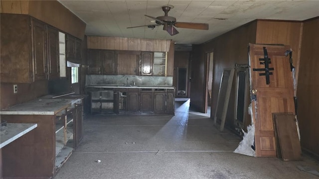 221 College Rd, Eunice, LA 70535 - kitchen with ceiling fan, light countertops, backsplash, and dark brown cabinetry