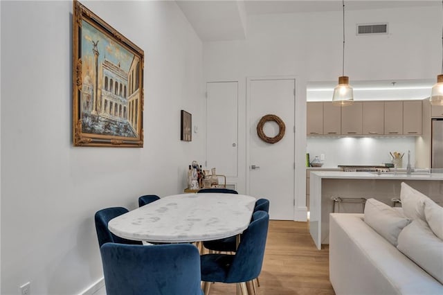 5940 Magazine St Unit 102, New Orleans, LA 70115 - dining area with light wood finished floors