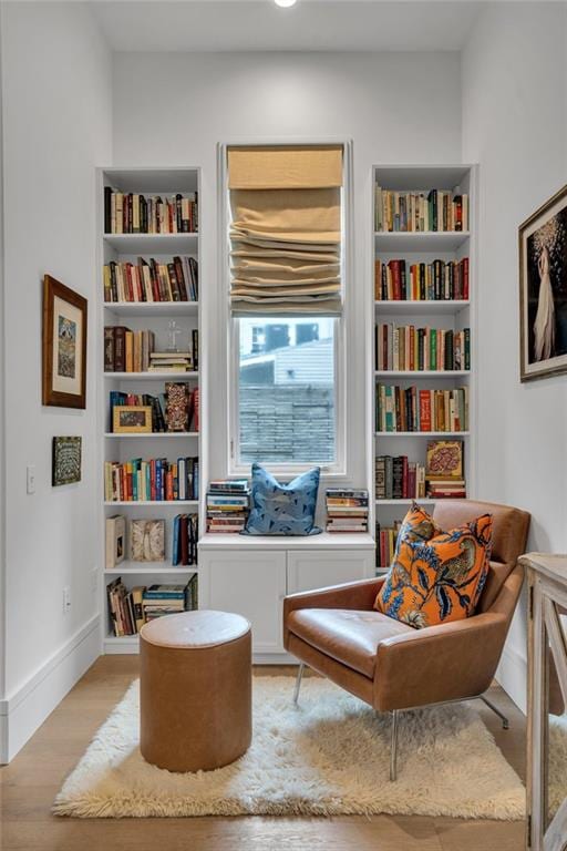 5940 Magazine St Unit 102, New Orleans, LA 70115 - sitting room featuring light wood finished floors and built in shelves