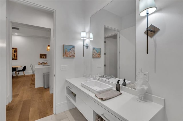 5940 Magazine St Unit 102, New Orleans, LA 70115 - bathroom with vanity and wood finished floors